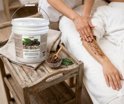 Person using coffee sugar scrub with a container and wooden bowl on a wooden stool.