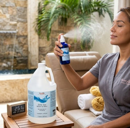 Woman holding a bottle of cleaning solution in an outdoor setting with a pool and fountain.