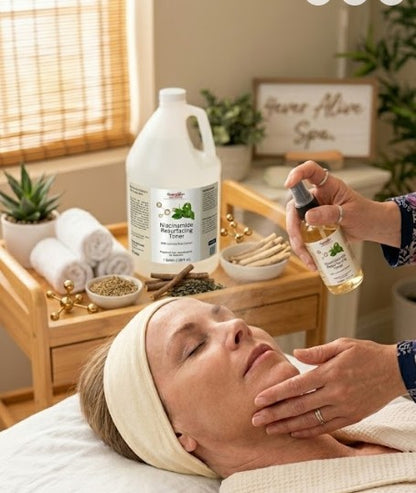 Woman receiving a Niacinamide Toner facial treatment in a spa setting with skincare products on a tray.