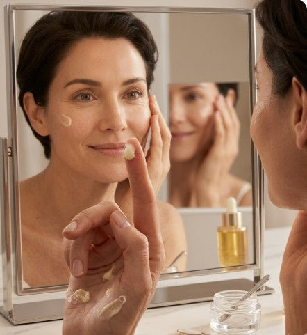 Woman applying triple Ceramide serum in her face.